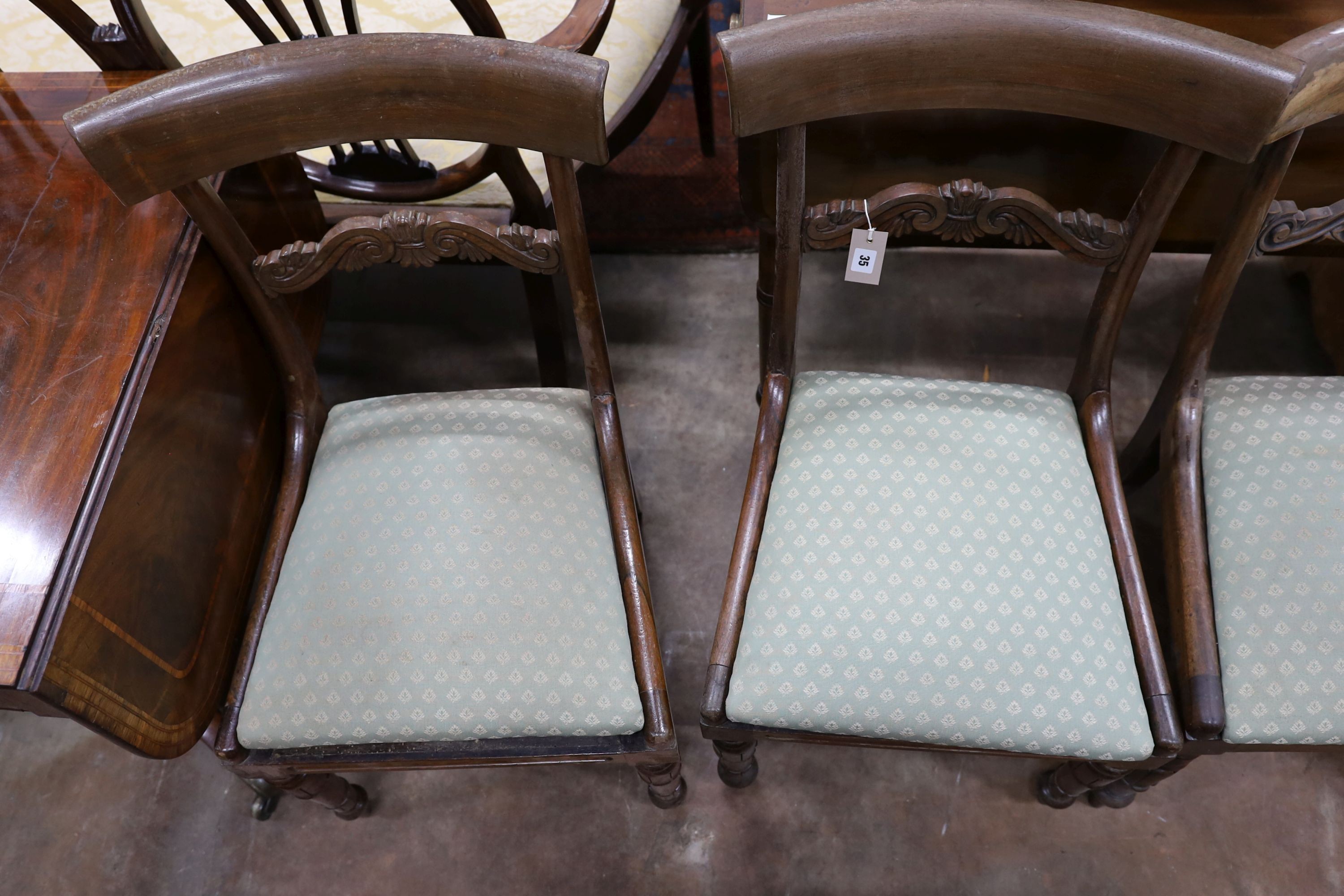 Two pairs of William IV mahogany and simulated rosewood dining chairs